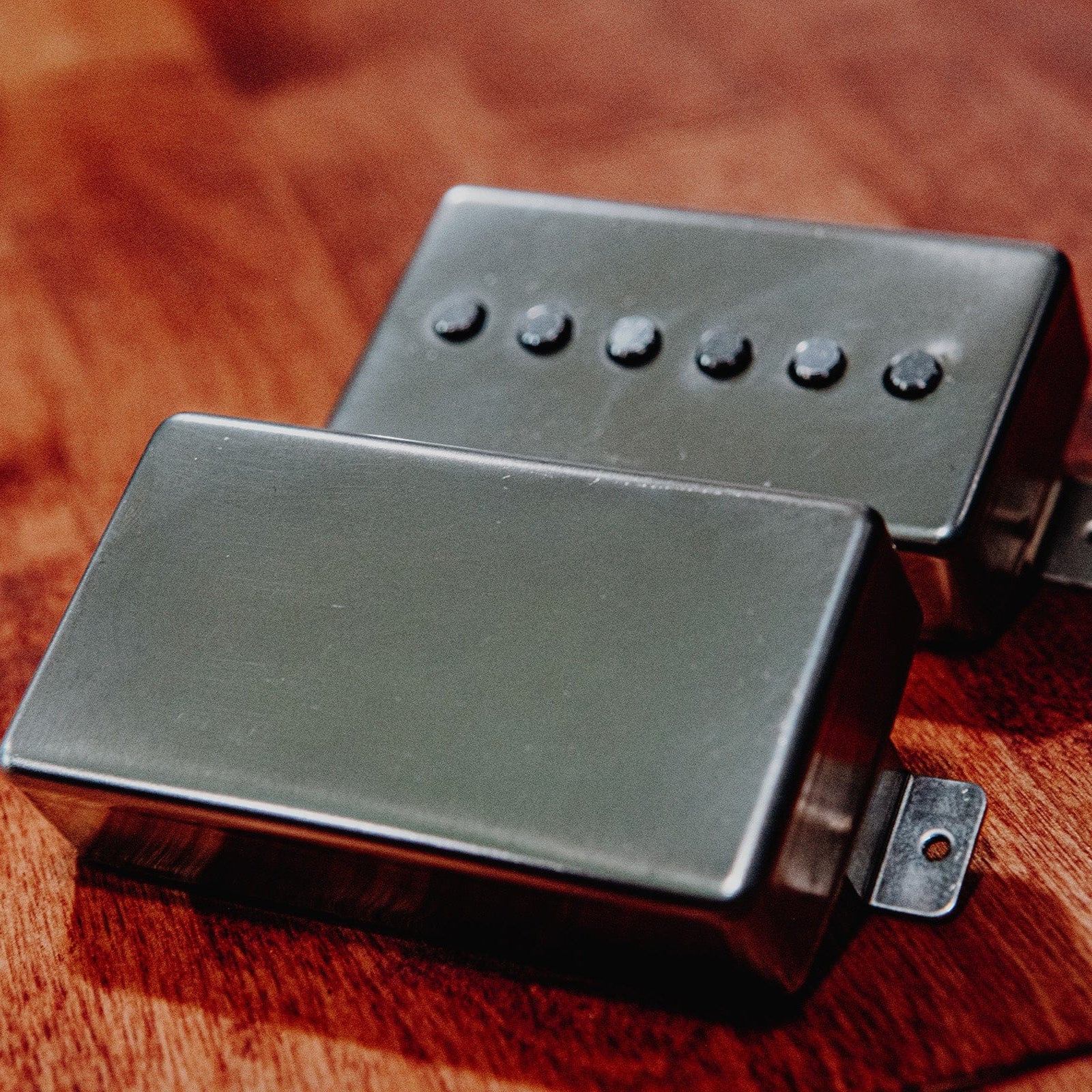 Black Mass guitar pickup on a wooden surface